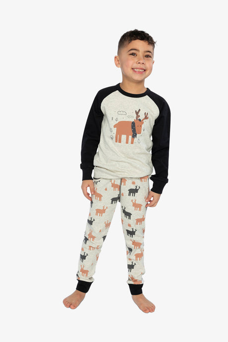 Child wearing the beige elk pajama set standing and smiling