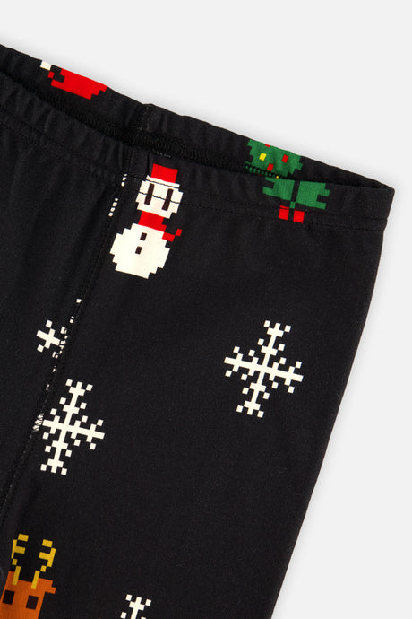 Close-up of the elastic waistband and pixel snowman print on the black pants