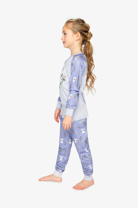 Child wearing the purple koala pajama set in side view