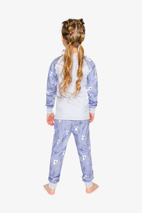 Child wearing the purple koala pajama set from behind with koala print sleeves and pants
