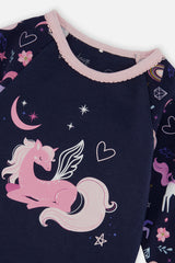 Close-up of the winged unicorn moon and star graphic on the navy pajama top