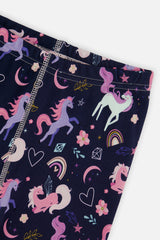 Close-up of the elastic waistband and unicorn rainbow print on the navy pants