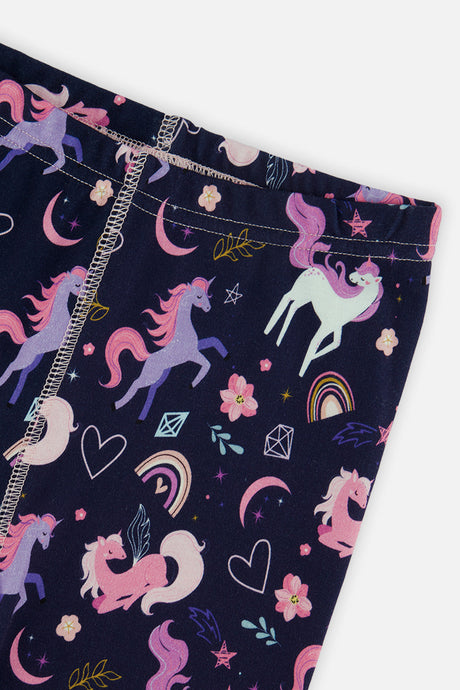 Close-up of the elastic waistband and unicorn rainbow print on the navy pants