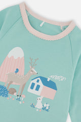 Close-up of the deer rabbit and house graphic on the mint pajama top
