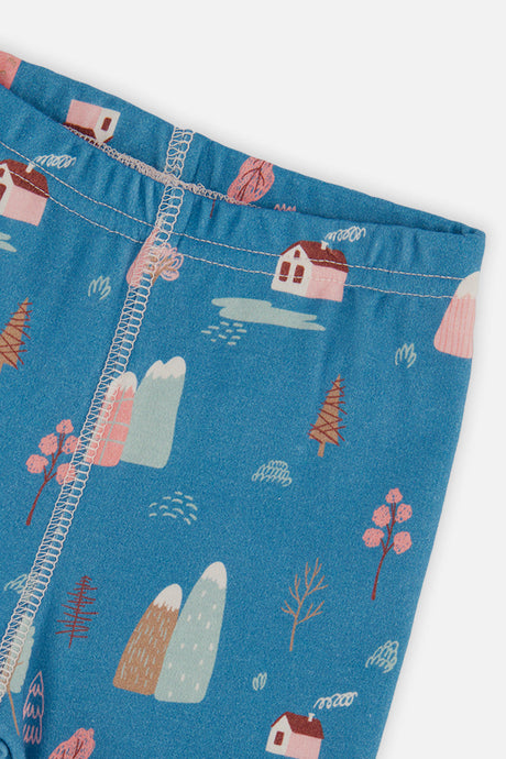 Close-up of the elastic waistband and house and mountain print on the blue pants