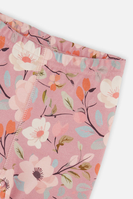 Close-up of the elastic waistband and floral print on the pink pajama pants