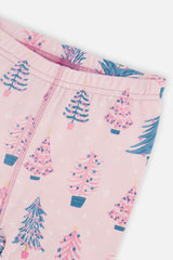 Close-up of the elastic waistband and the teal and pink decorated trees on the pale pink pajama pants