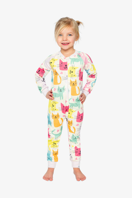 Child wearing the cat print one-piece pajama with hands on hips, front view