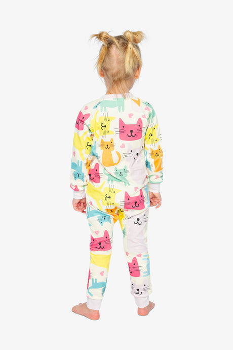 Back view of a child wearing the one-piece pajama covered in pink, yellow, aqua and orange cats