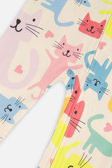 Close-up of the colorful cats and hearts on the white one piece pajama