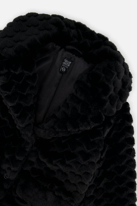 Close-up of the black faux fur collar with the textured heart pattern