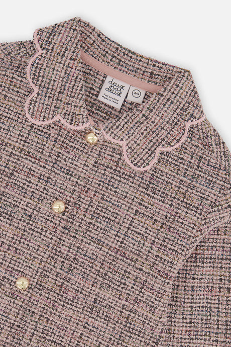 Close-up of the pink scalloped collar and round buttons on the pink and black Deux par Deux jacket