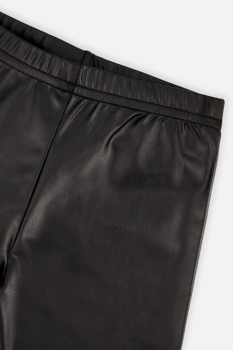 Close-up of the glossy faux leather and elastic waistband on black leggings