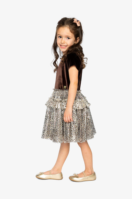 Child wearing the Deux par Deux brown velvet dress with a leopard print mesh skirt, side view