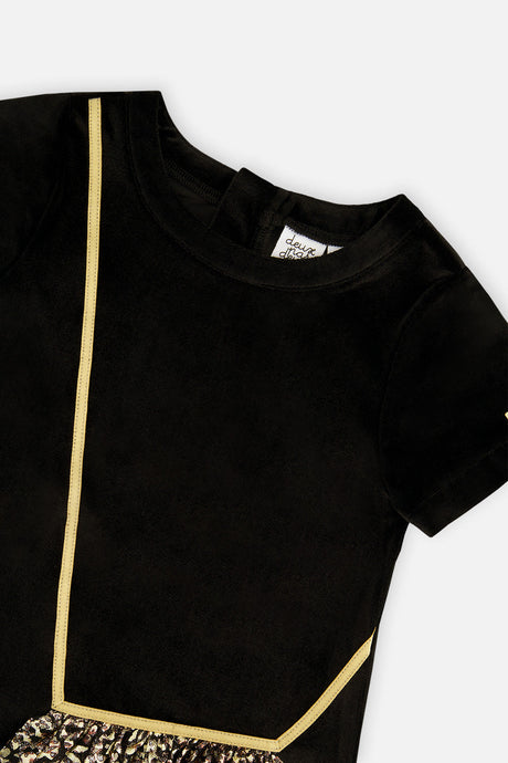 Close-up of the gold cord trim and neckline on the Deux par Deux black velour dress