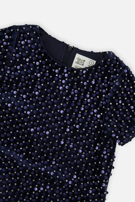 Close-up of the sparkly dark blue velour fabric at the neckline and shoulder