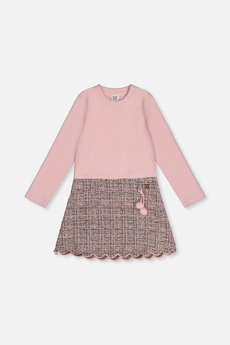 Front view of the pink and black knit dress with a pink rib bodice and patterned skirt