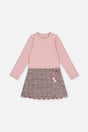 Front view of the pink and black knit dress with a pink rib bodice and patterned skirt