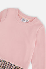Close-up of the pink brushed rib bodice and neckline above the jacquard skirt