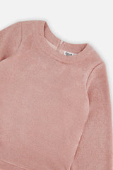 Close-up of the dusty pink knit neckline and sleeve on the Deux par Deux party dress