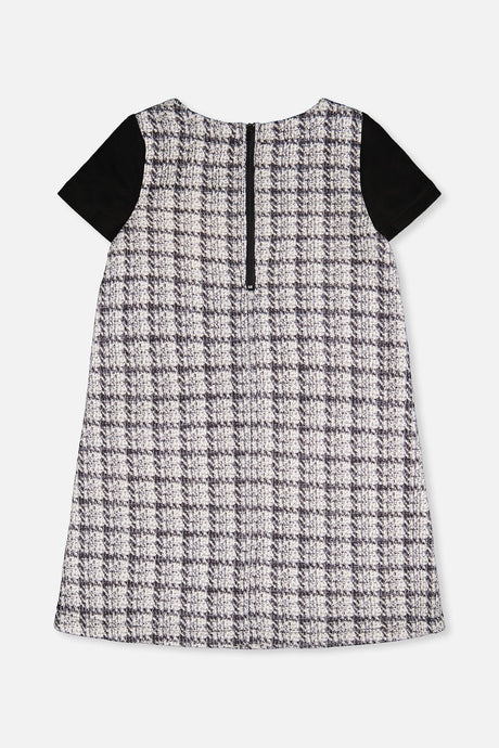 Back view of the black and white plaid dress with a centre back zip