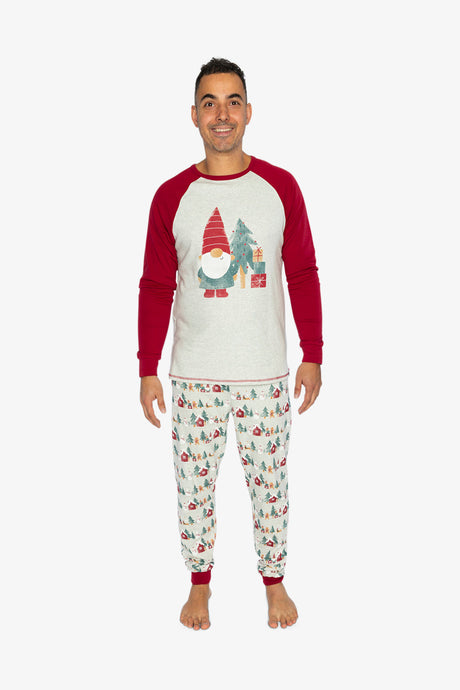 Man wearing the Christmas pajama set facing the camera with a gnome graphic on the grey top