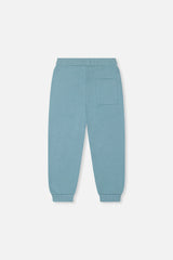 Deux par Deux pale turquoise fleece sweatpants, back view with a patch pocket and ribbed cuffs