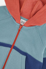 Close-up of the orange zipper and the coral hood lining on the blue Deux par Deux fleece jacket