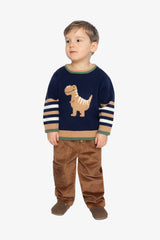 Full-length view of a child in the Deux par Deux navy dino intarsia sweater