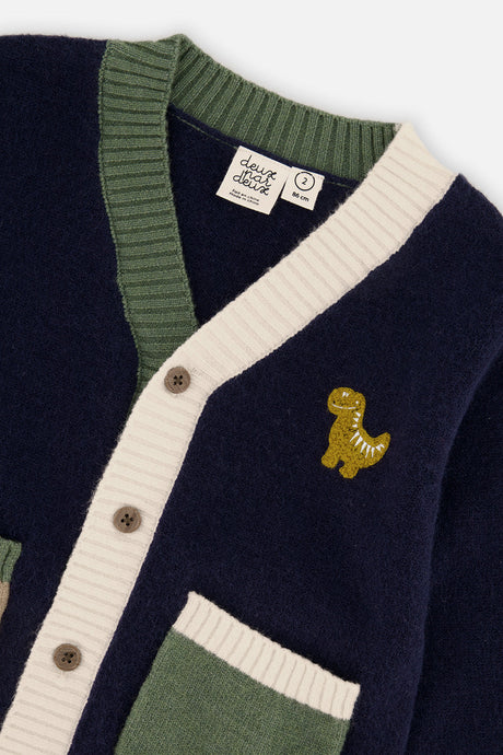 Close-up of the embroidered dino, buttons and ribbed placket on the Deux par Deux navy cardigan