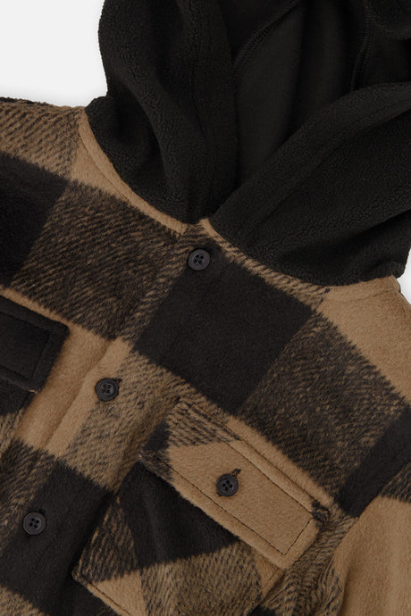 Close-up of the plaid flannel, buttoned chest pocket and black fleece hood