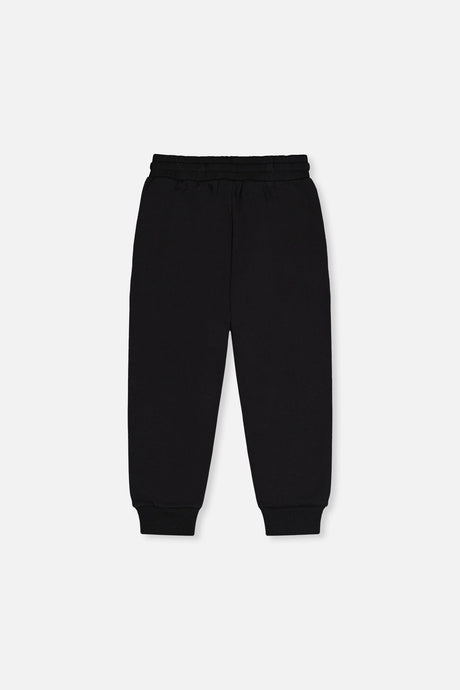 Deux par Deux black fleece sweatpants, back view with ribbed ankle cuffs