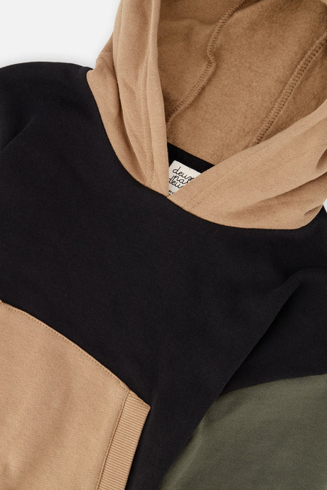 Close-up of the tan hood and the black and olive green panels on the Deux par Deux fleece