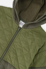 Close-up of the quilted panel, zipper and hood on the Deux par Deux green cardigan