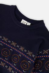 Close-up of the orange smiley faces and cross motifs on the dark blue Deux par Deux sweater