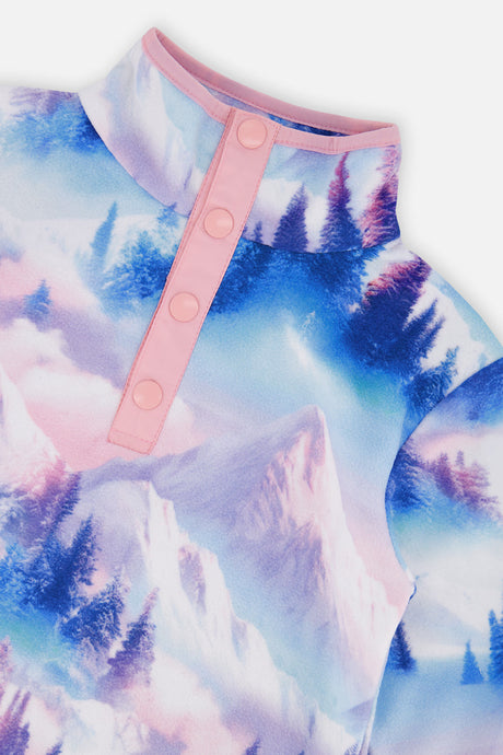 Close-up of the pink four-snap placket and stand collar on the blue and pink mountain print fleece pullover
