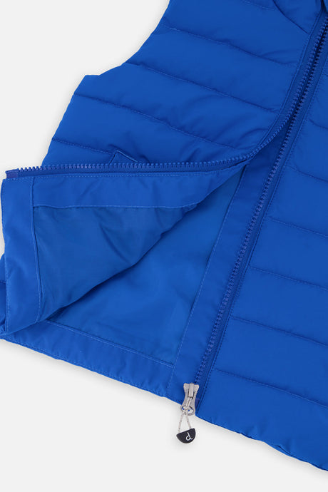 Inside of the blue quilted vest showing the lining and zipper