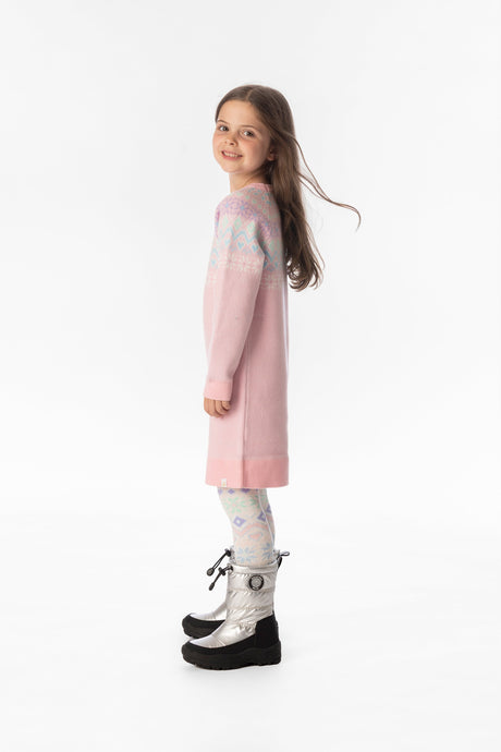 Child wearing the light pink Fair Isle knit dress, side view