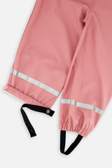 Close-up of the ankle cuffs and reflective strips on the pink Deux par Deux rain overalls