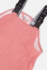 Close-up of the bib and elastic side panels on the pink Deux par Deux rain overalls
