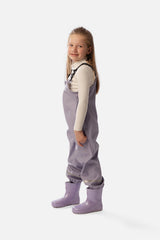 Child wearing the Deux par Deux mauve rain overalls, side view