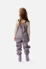 Child wearing the Deux par Deux mauve rain overalls, back view