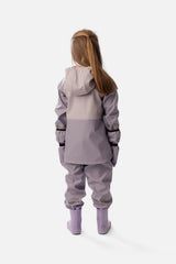 Child wearing the mauve Deux par Deux rain jacket with matching rain pants and boots, back view