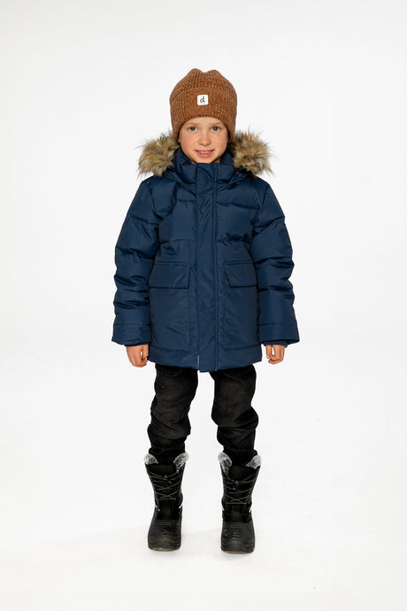 Child wearing the Deux par Deux dark blue winter jacket with faux-fur hood, view 1
