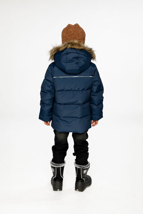 Child wearing the Deux par Deux dark blue winter jacket with faux-fur hood, view 2