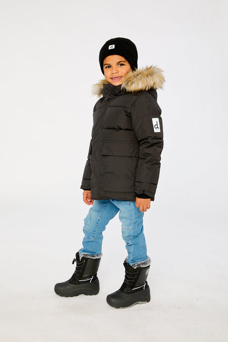 Child wearing the Deux par Deux black winter jacket with faux-fur hood, view 2