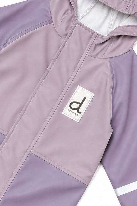 Close-up of the two-tone mauve front, zipper placket and d logo patch