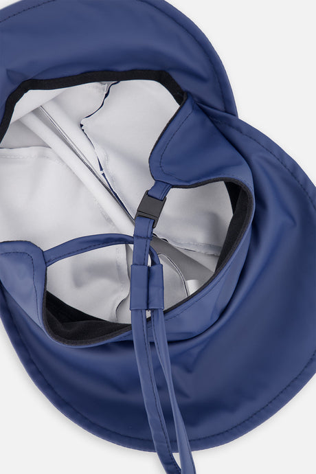 Underside of the dark blue kids' rain hat showing the chin strap