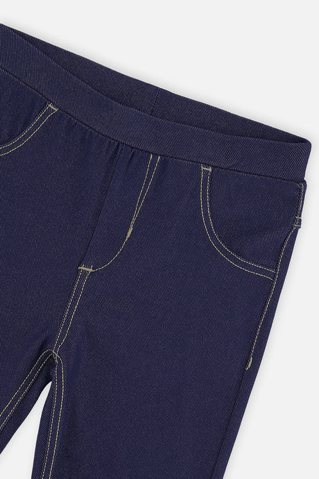 Close-up of the waistband and pocket stitching on the Deux par Deux navy denim look jeggings