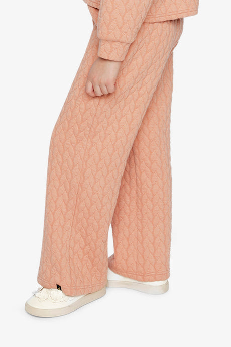 Child wearing the Wide Leg Jacquard Pants Pink, side view